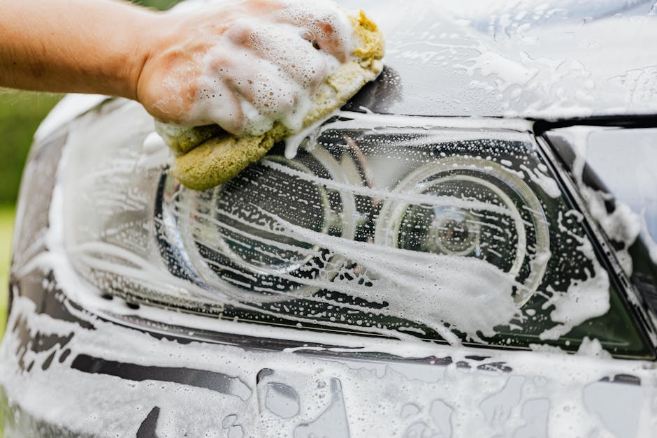 Thick foam suds covering a car during a wash